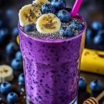 Healthy Banana-Blueberry Smoothie in a glass with fresh ingredients