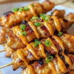 Delicious Bang Bang Chicken Skewers served with dipping sauce