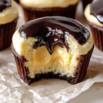 Delicious Boston Cream Cupcakes topped with chocolate and filled with vanilla custard
