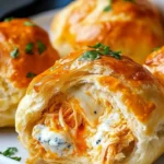 Buffalo Chicken Bombs served on a plate, drizzled with ranch dressing.