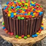 Chocolate M&M celebration cake with colorful candies on top