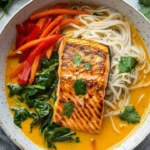 Delicious coconut curry salmon served over rice noodles