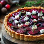 Delicious Cranberry and Roasted Beet Tart served on a wooden table