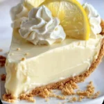 Deliciously creamy cream cheese lemonade pie with a fresh lemon topping.