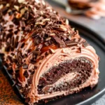 Double chocolate almond caramel cake roll with chocolate glaze and nuts