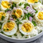 Delicious egg salad with cottage cheese and herbs served in a bowl