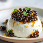 Espresso pearls served on whipped mascarpone with a sprinkle of orange zest.