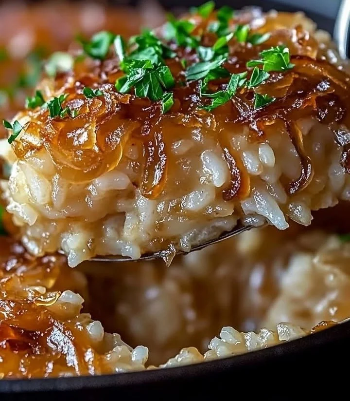 Delicious bowl of French Onion Butter Rice garnished with herbs.