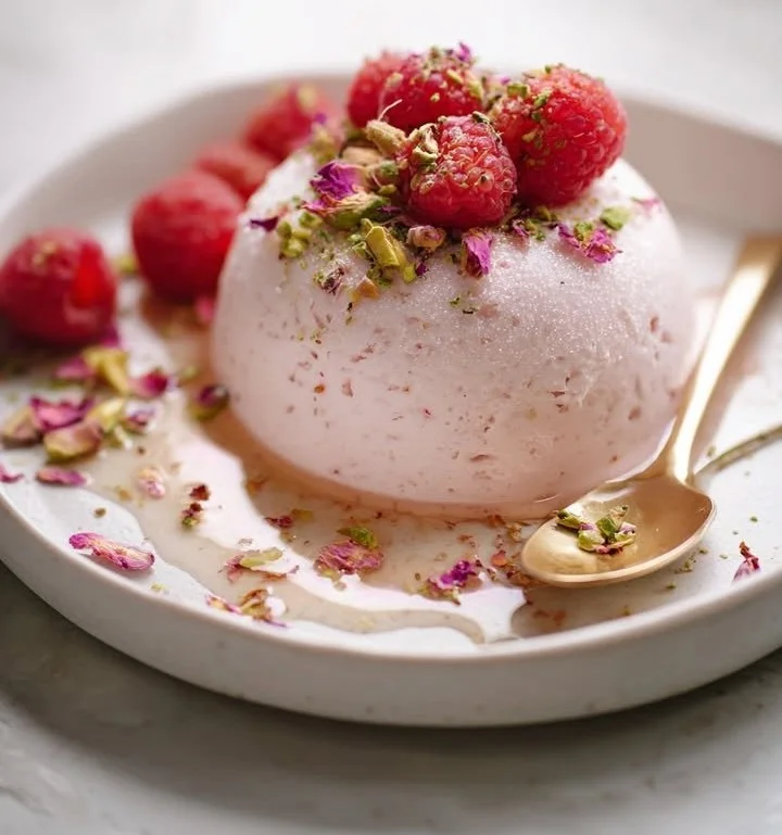 Frozen Rose Mascarpone Mousse topped with fresh raspberries