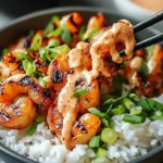 Hawaiian shrimp poke bowl with fresh ingredients and sriracha mayo drizzle