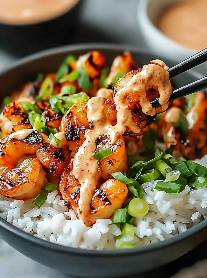 Hawaiian shrimp poke bowl with fresh ingredients and sriracha mayo drizzle