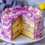 Lavender Lemon Cream Cake with White Chocolate Frosting served on a rustic table