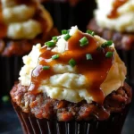 Delicious Meatloaf Cupcakes topped with creamy whipped potatoes