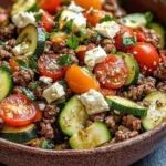 Mediterranean ground beef stir fry with colorful vegetables and spices.