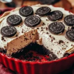 No-Bake Oreo Mud Pie topped with crushed Oreos and whipped cream