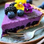 No-bake vegan blueberry chia seed pie with fresh blueberries on top.