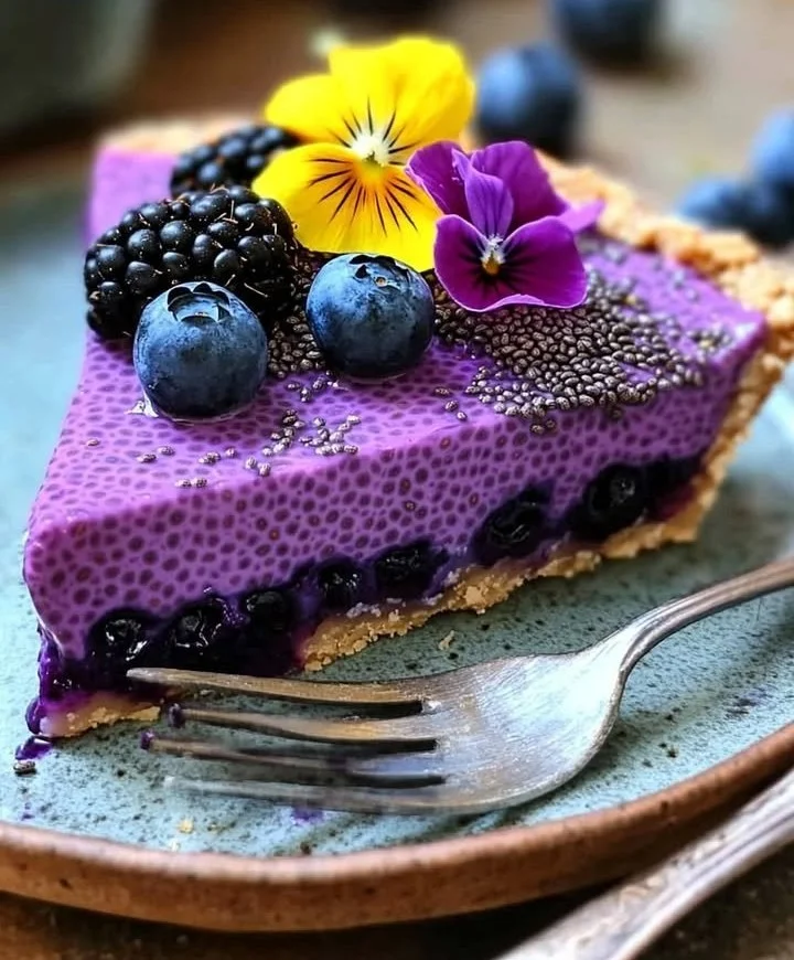 No-bake vegan blueberry chia seed pie with fresh blueberries on top.