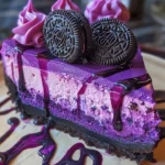 Purple Velvet Oreo Cheesecake topped with crushed Oreos and vibrant purple frosting.