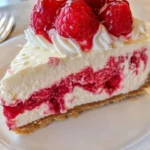 Delicious Raspberry Cheesecake with white chocolate on a decorative plate