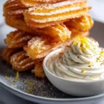 Savory Parmesan churros with whipped burrata dip on a serving platter.