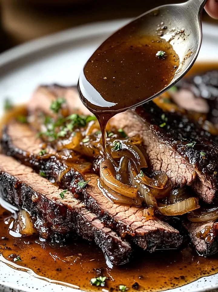 Slow Cooker Brisket served with rich Balsamic Onion Gravy on a plate