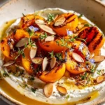 Smoky Stone Fruit paired with herbed cheese on a serving platter