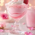 A refreshing Strawberry Rose Mocktini garnished with strawberries and rose petals