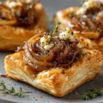Upside-down Feta and caramelized shallot puff tarts on a serving plate