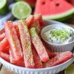 Watermelon fries served with coconut lime dip on a plate